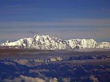 Tibet Kailash 12 Flying From Kathmandu 08 Annapurna Here is the wide south face of Annapurna I (8091m), the 10th highest mountain in the world. The 4000m south face was first climbed by Don Whillans and Dougal Haston in 1970 on Chris Boningtons British Expedition, the first big Himalayan face to be climbed. The knob of rock to the left is called The Fang (7647m).